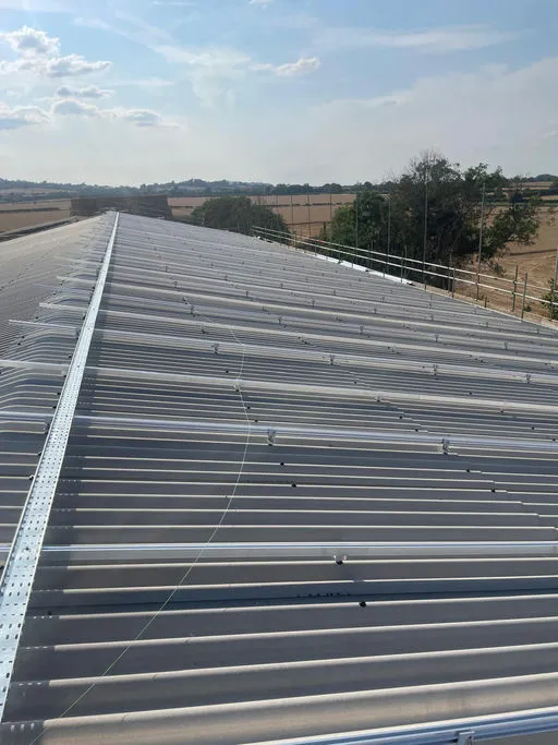 A 219 kWp rooftop solar array across the barns of a working farm in south Warwickshire - photo 3